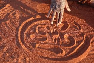 Drawing symbols in a sand story. Photo: Jennifer Green