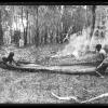 Charlie Murray (left) and Neil Morcom (right) engaged in canoe construction in the Port Macquarie hinterland.