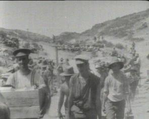 Men of the Australian forces make their way up “Monash Valley”, past the headquarters of Generals Monash and Chauvel.